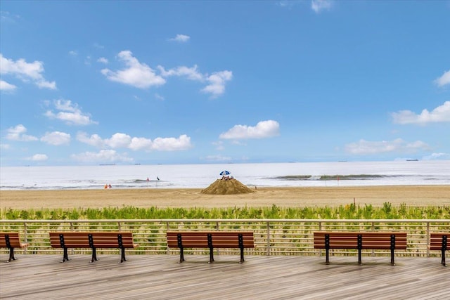 view of home's community featuring a view of the beach and a water view