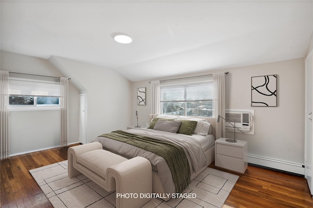 bedroom featuring baseboard heating, dark hardwood / wood-style floors, vaulted ceiling, and a wall unit AC