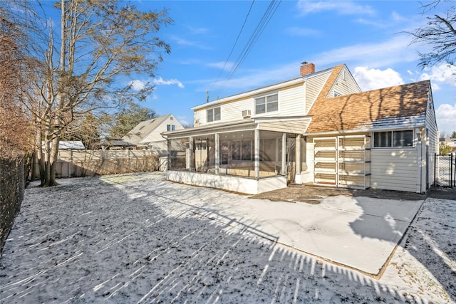 back of house with a sunroom