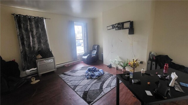 living room with a baseboard radiator and dark wood-type flooring