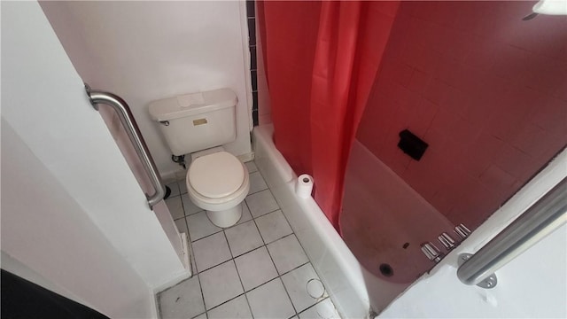 bathroom featuring tile patterned floors, toilet, and shower / bathtub combination with curtain