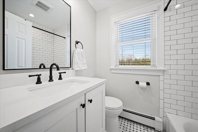 bathroom with vanity, a baseboard radiator, and toilet