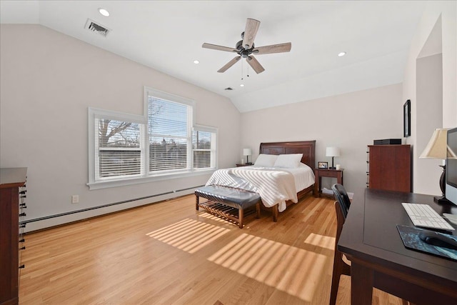 bedroom featuring ceiling fan, light wood-type flooring, vaulted ceiling, and a baseboard heating unit