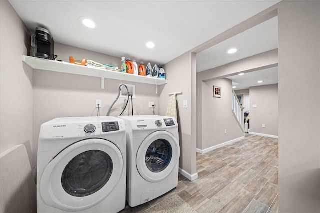 clothes washing area with independent washer and dryer