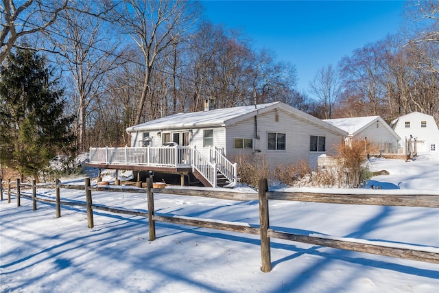 view of front of property with a wooden deck