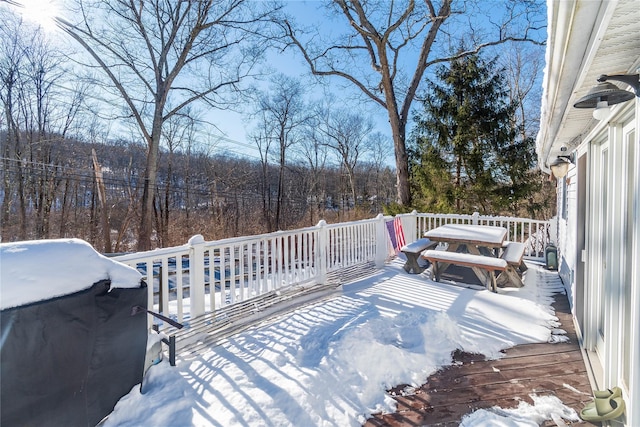 snow covered deck featuring grilling area