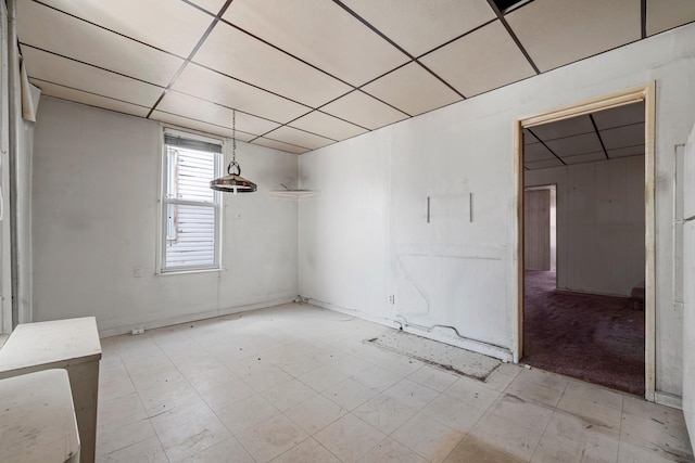 empty room with a paneled ceiling