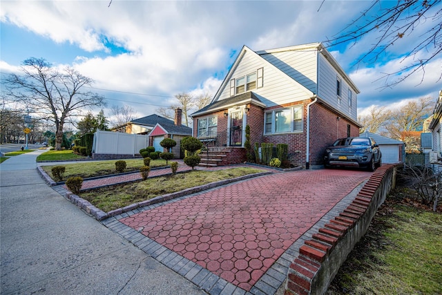 view of front of home with a front yard and a garage