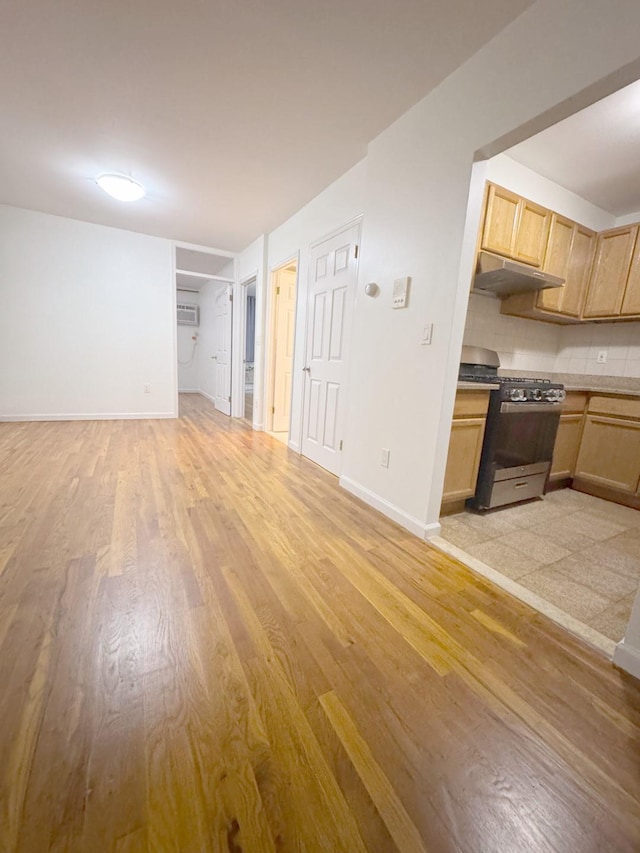 unfurnished living room featuring light hardwood / wood-style floors