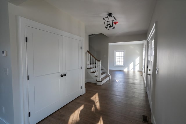 corridor featuring dark hardwood / wood-style floors