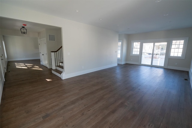 empty room with dark wood-type flooring