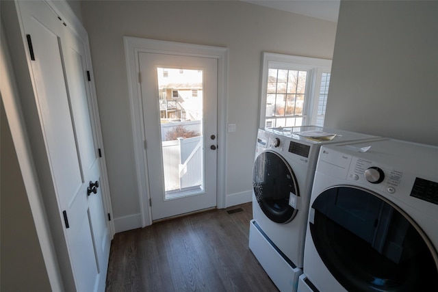 washroom featuring separate washer and dryer and dark wood-type flooring