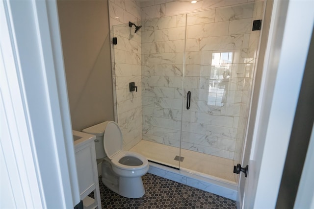 bathroom with tile patterned flooring, toilet, and a shower with shower door