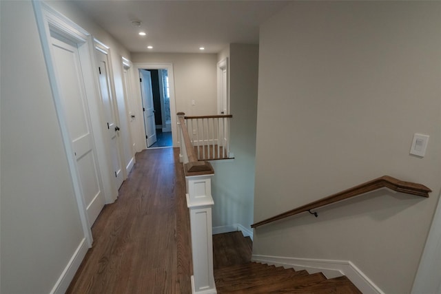 corridor featuring dark hardwood / wood-style floors