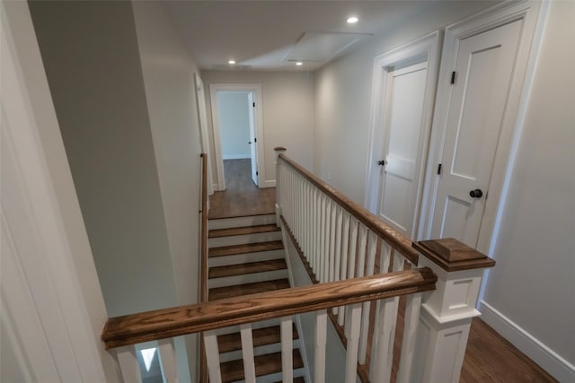 staircase featuring hardwood / wood-style floors