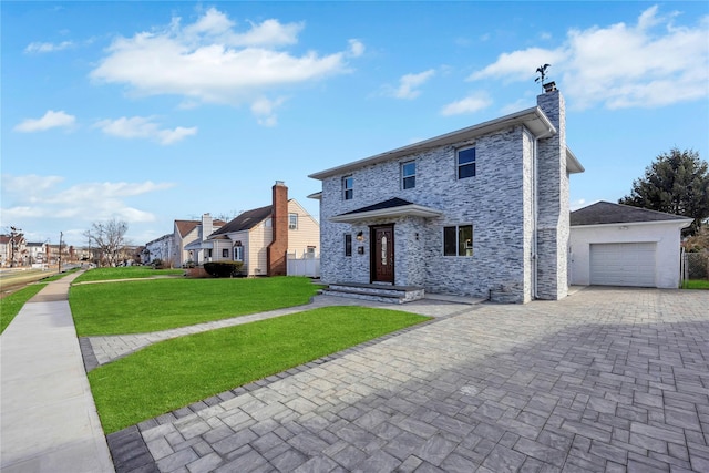 view of front of house featuring a garage and a front yard