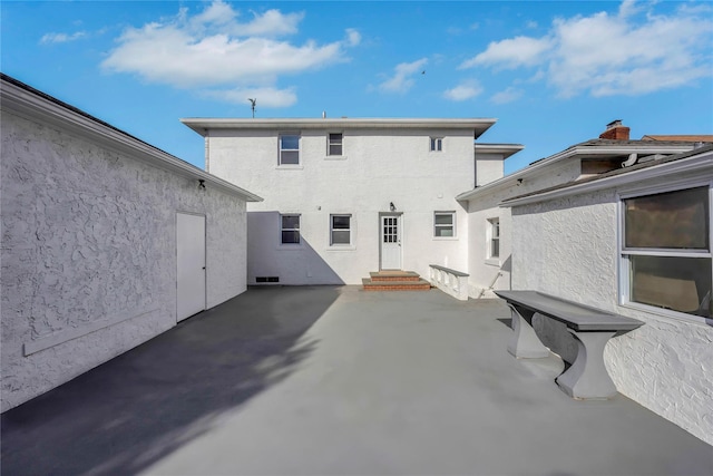 rear view of house featuring a patio area