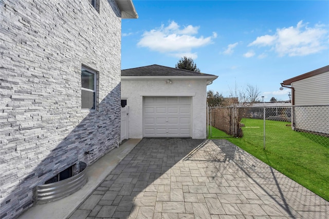 garage featuring a yard