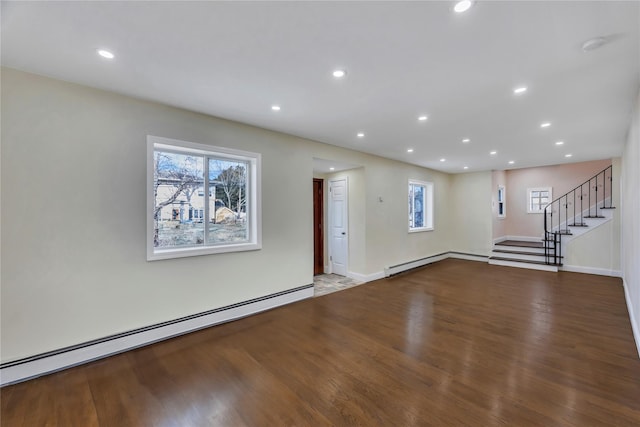 interior space featuring light hardwood / wood-style flooring, a wealth of natural light, and a baseboard heating unit