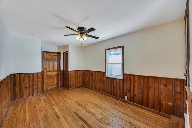 unfurnished room featuring ceiling fan and light hardwood / wood-style floors