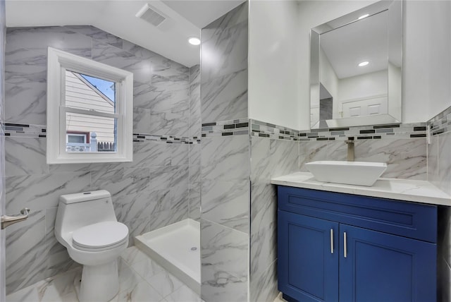 bathroom with toilet, vanity, tile walls, and walk in shower