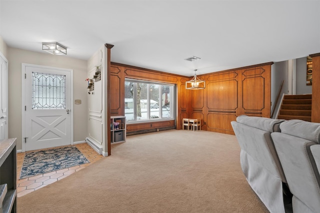 interior space featuring light colored carpet and baseboard heating