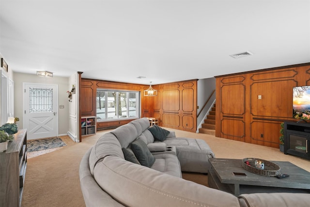 living room featuring light carpet