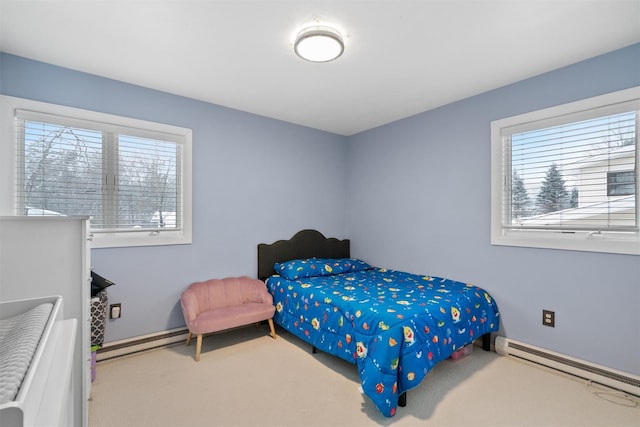 bedroom featuring a baseboard heating unit and carpet flooring