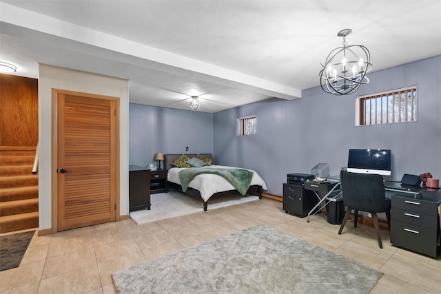 bedroom with light tile patterned flooring and a notable chandelier