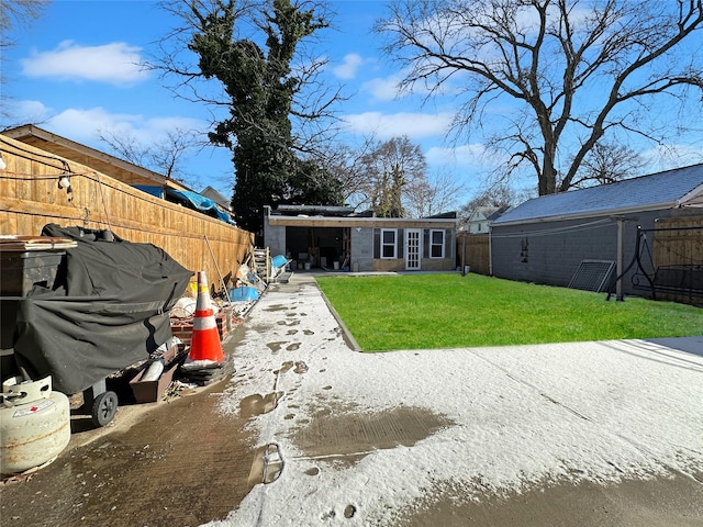 rear view of house featuring a yard and a patio