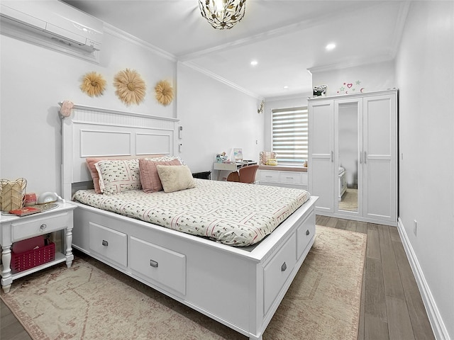 bedroom featuring a wall unit AC, crown molding, and light hardwood / wood-style flooring