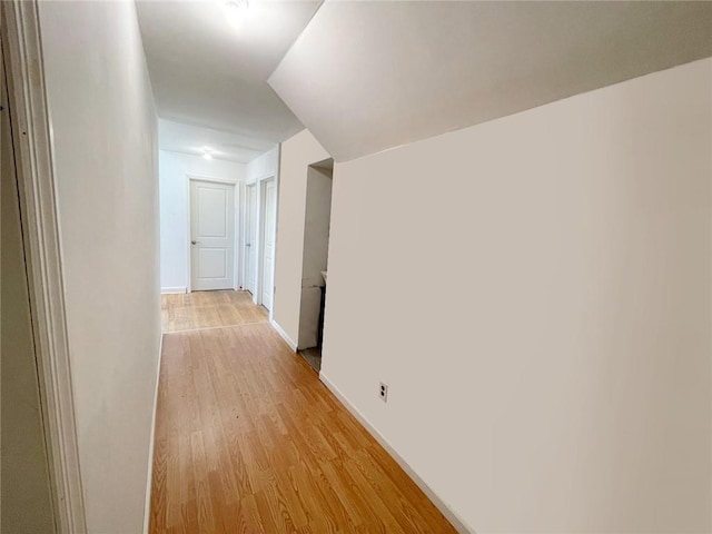 corridor featuring light hardwood / wood-style flooring