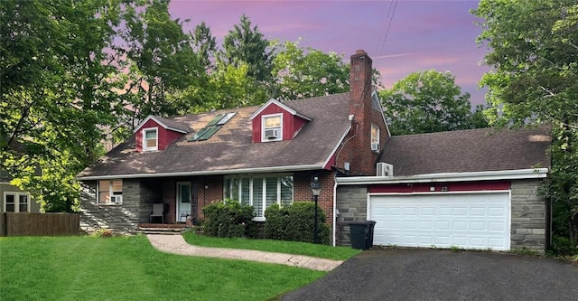 cape cod house with a garage and a lawn