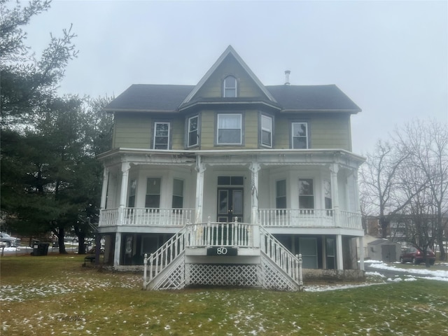 view of front facade with a front lawn and a porch