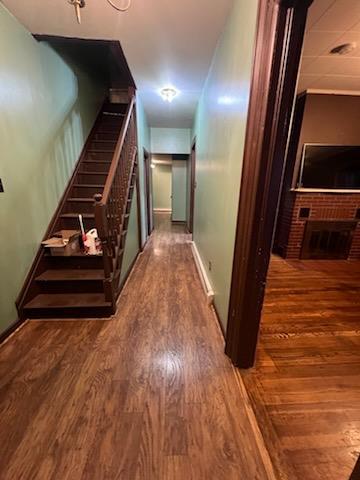 corridor with dark wood-type flooring