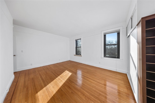 spare room featuring light hardwood / wood-style flooring