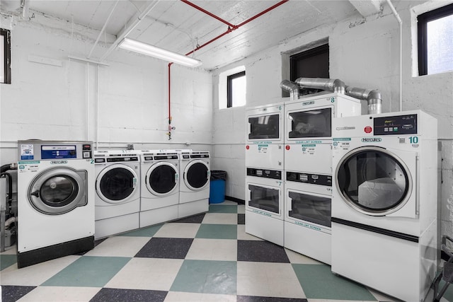 laundry room with washing machine and dryer and stacked washer and clothes dryer