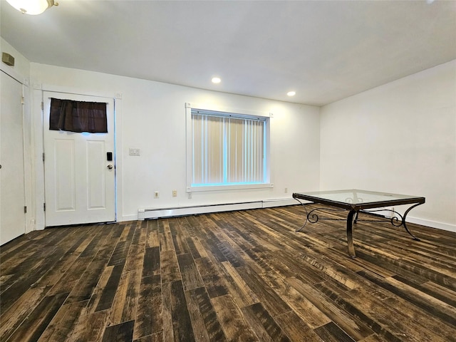 foyer featuring dark hardwood / wood-style floors and a baseboard heating unit