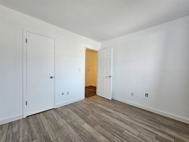 empty room featuring hardwood / wood-style flooring