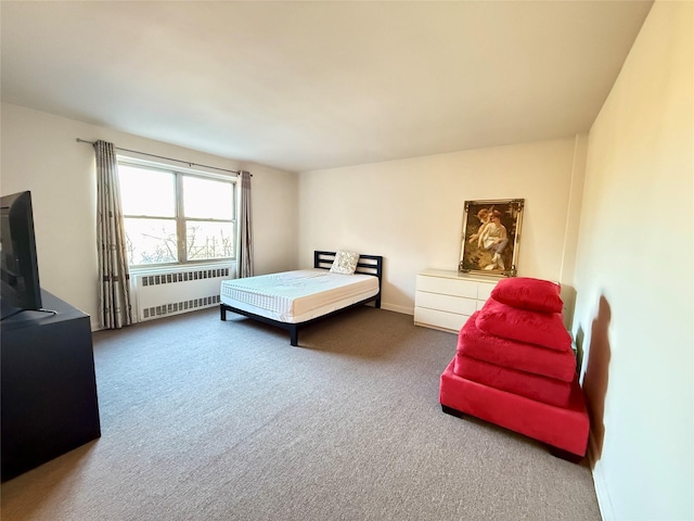 bedroom featuring carpet floors and radiator