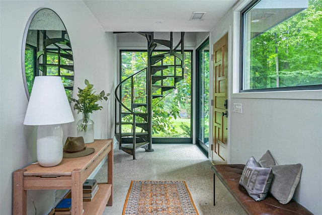 entryway featuring speckled floor and visible vents