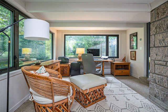 home office featuring light carpet, beam ceiling, and baseboards