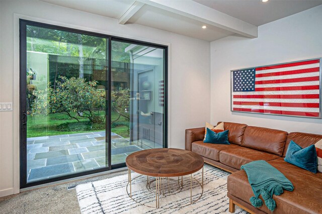 living area featuring recessed lighting and beamed ceiling