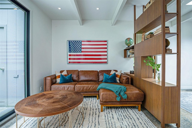 living area with beamed ceiling and recessed lighting