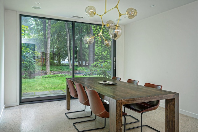 dining room featuring visible vents, baseboards, and speckled floor