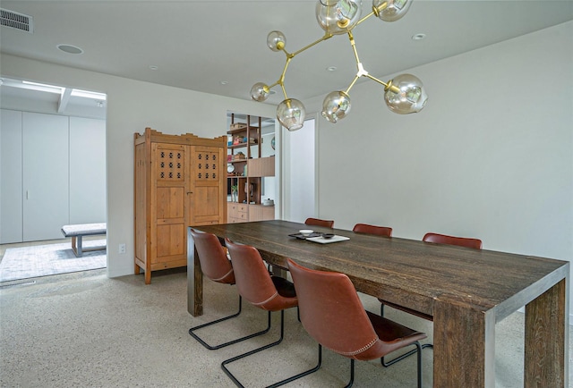 dining space with speckled floor and visible vents