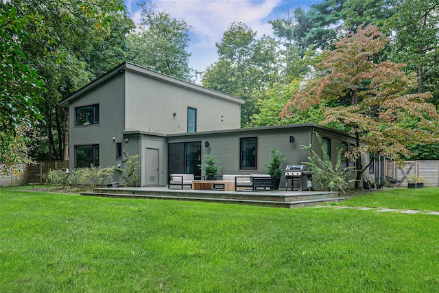 back of property featuring a patio, a lawn, and fence