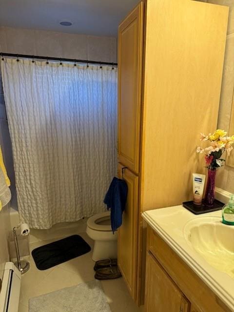 full bathroom with a baseboard radiator, tile patterned flooring, toilet, shower / tub combo with curtain, and vanity