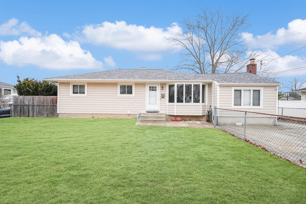 ranch-style house with a front lawn