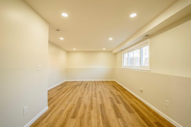 empty room with light hardwood / wood-style floors